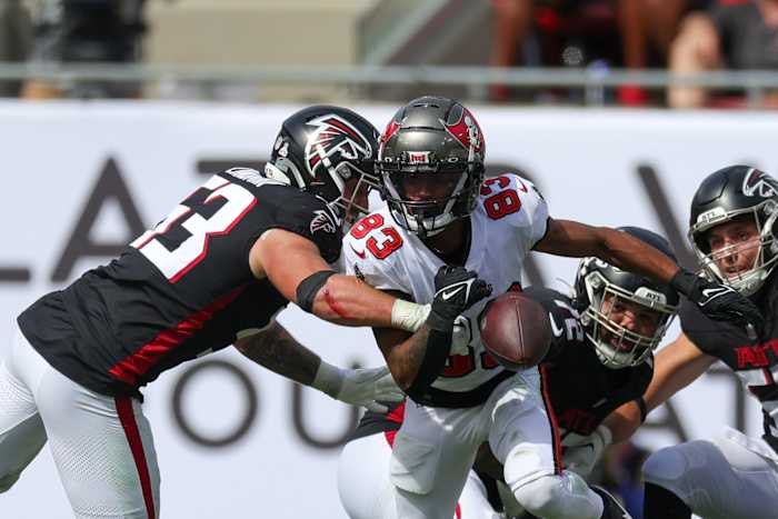 Oct 22, 2023; Tampa, Florida, USA; Atlanta Falcons linebacker Nate Landman (53) causes a fumble by Tampa Bay Buccaneers wide receiver Deven Thompkins (83) in the third quarter at Raymond James Stadium.